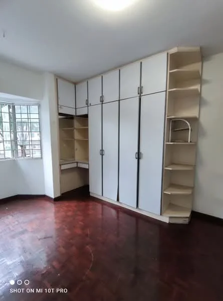 Bedroom features: built-in wardrobe with sliding doors, open shelving unit, wooden flooring, large window with grid pattern, neutral wall color, ceiling light fixture; style: modern.