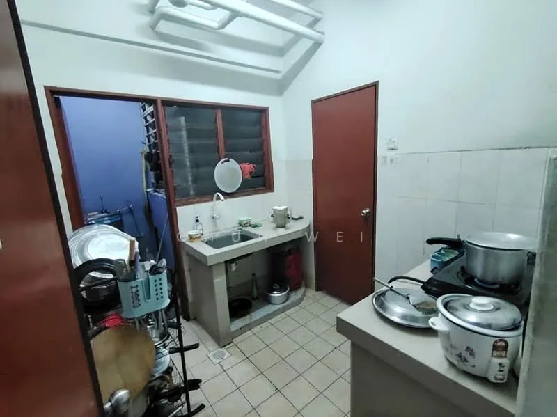 Kitchen features: grey countertop, single-bowl stainless-steel sink, chrome faucet, wall-mounted cabinets, tile backsplash, ceramic tile flooring, stainless-steel gas stove, stainless-steel pot, plastic containers, kitchen utensils, window with metal grill, door leading to another room.
