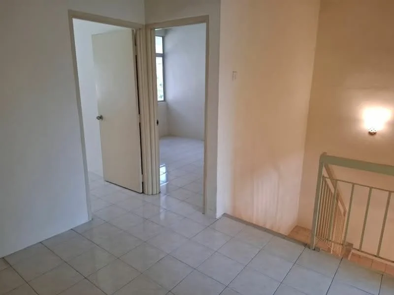 Room features: white painted walls, tile flooring, single door, window with natural light, staircase railing, wall-mounted light fixture.