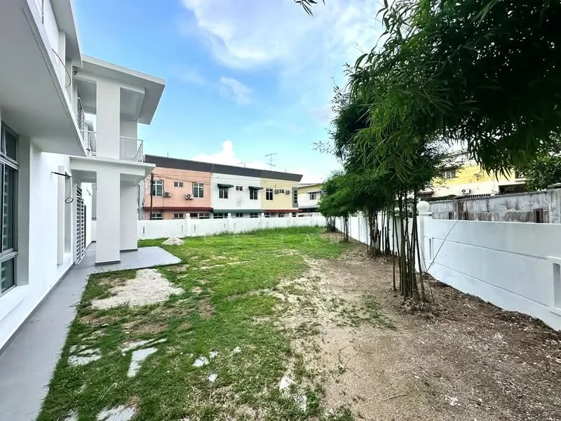 Exterior type: linked terrace house; features: manicured lawn, concrete pathway, white painted facade, two-storey building, surrounded by low-rise residential buildings, fenced perimeter, bamboo plants, open space, clear blue sky; style: modern.
