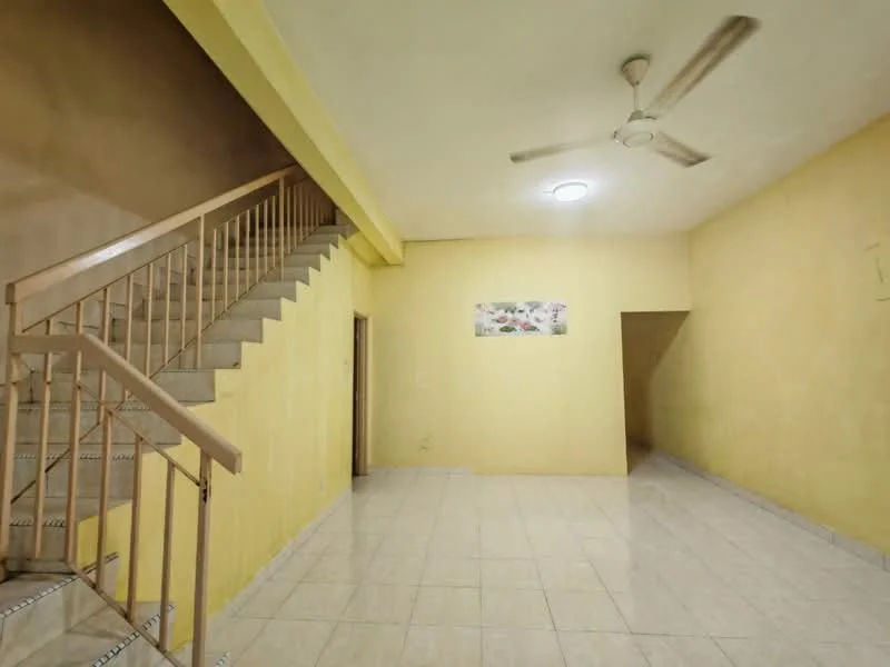 Room features: yellow painted walls, ceramic tile flooring, ceiling fan, staircase with wooden railing, recessed ceiling light, open layout, no visible furniture, large empty space.