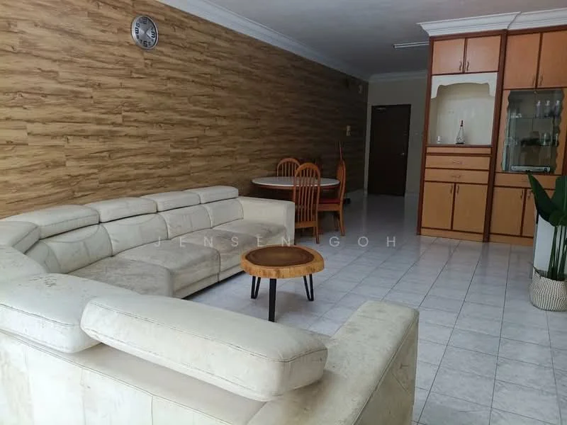 Living features: L-shape sectional sofa in cream, wooden coffee table, dining table with four wooden chairs, cream tiled flooring, wood panel accent wall, wall clock, built-in wooden cabinetry, doorway leading to other rooms; style: modern.