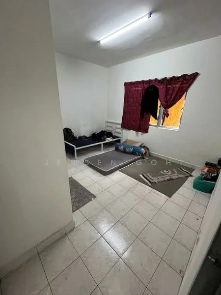 Room features: white painted walls, tile flooring, window with red curtains, single bed, mattress on the floor, area rug, small table, clothes hanging on the curtain rod, light fixture on ceiling; style: minimalist.