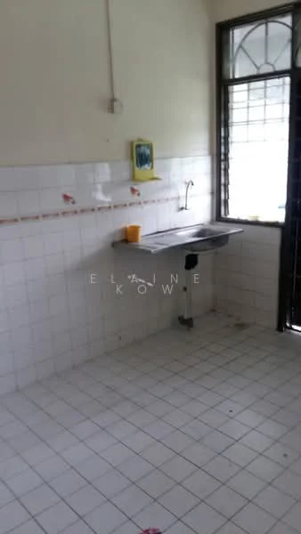 Room features: white tiled walls, white tiled flooring, stainless-steel sink, wall-mounted faucet, window with metal grille, yellow wall-mounted shelf, two orange buckets, no visible cabinetry.