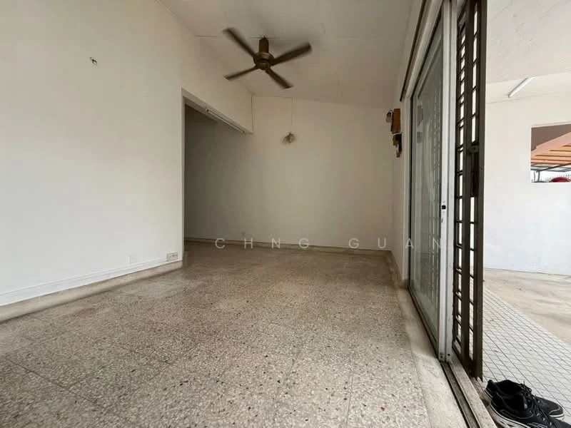 Room features: white painted walls, exposed ceiling, ceiling fan, terrazzo flooring, sliding glass door, natural light from large window, open layout, no visible furniture; style: minimalist.