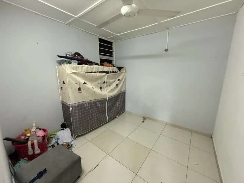 Room features: white painted walls, ceiling fan, tile flooring, window with security bars, curtain or fabric divider, storage box, toys visible, basket for storage.