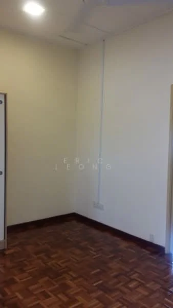 Room features: wooden flooring, white painted walls, ceiling light, corner with electrical outlets, door frame, baseboard, wall-mounted air conditioning unit.