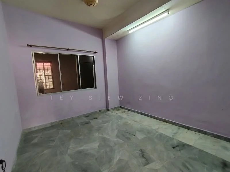 Room features: light purple painted walls, marble flooring, large window with metal frame, ceiling light fixture, no visible furniture, corner of room with no features, neutral color scheme, plain ceiling.