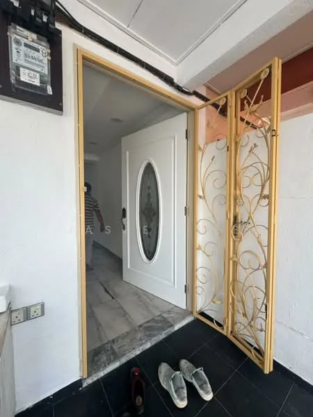 Room features: white painted walls, marble flooring, black tile flooring, decorative metal door with floral design, oval glass insert in door, ceiling lights, door frame with wooden finish; style: modern.