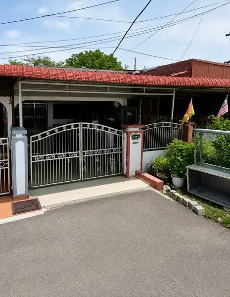 Exterior type: semi-detached house; features: red tiled roof, white painted facade, metal gate with decorative design, paved driveway, landscaped garden with potted plants, visible electrical wiring, surrounding greenery; style: traditional.