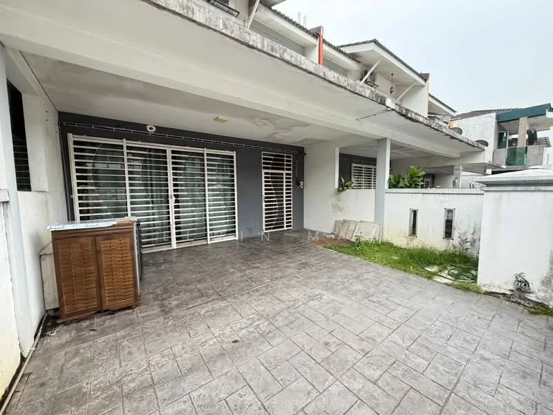 Exterior type: linked terrace house; features: covered patio area, sliding glass doors, grilled security bars, textured concrete flooring, fenced yard, greenery visible, white painted walls, two-storey structure, adjacent to other houses; style: modern.