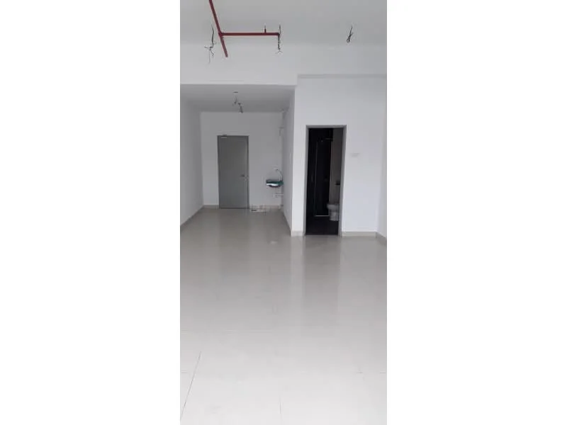 Room features: white painted walls, polished tile flooring, ceiling with exposed piping, single door, doorway leading to bathroom, doorway leading to another room, no visible furniture or decor; style: modern.