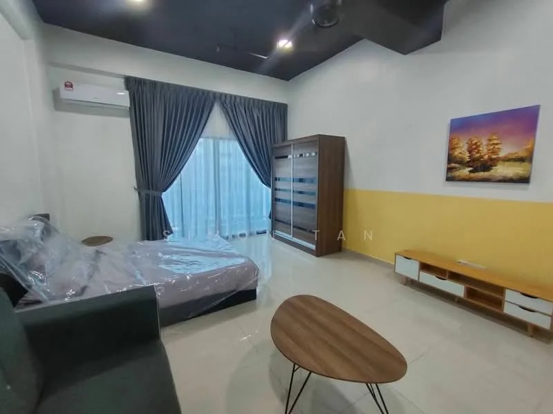 Room features: grey fabric sofa, queen-size bed with protective covering, wooden TV console, round coffee table, floor-to-ceiling windows with sheer curtains, air conditioning unit on wall, yellow accent wall, white painted walls, glossy tile flooring, decorative artwork on wall; style: modern.