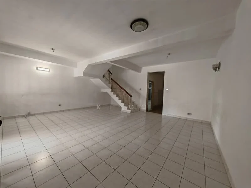 Living features: white painted walls, tile flooring, staircase with wooden railing, ceiling light fixture, two wall sconces, open layout, no visible furniture, large floor area.