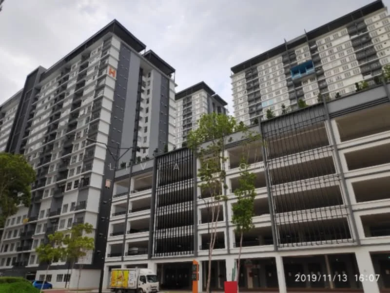 Exterior type: high-rise condominium; features: glass curtain wall, grey painted facade, balconies with glass railings, multi-storey car park, landscaped greenery, surrounded by mature trees; style: modern.