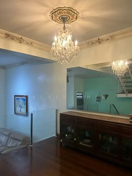 Living features: chandelier, crown moulding, wood flooring, glass railing, mirrored wall, sofa, decorative artwork, open layout to kitchen; style: traditional.