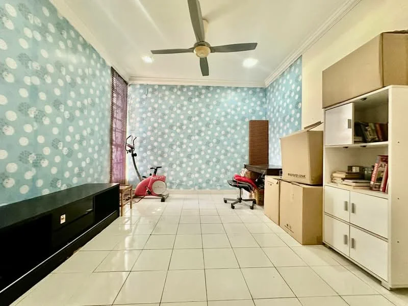 Room features: blue wallpaper with white polka dots, white tiled flooring, ceiling fan, large window with blinds, black TV console, white storage cabinet, cardboard boxes, exercise bike, red office chair, wooden slatted screen; style: modern.