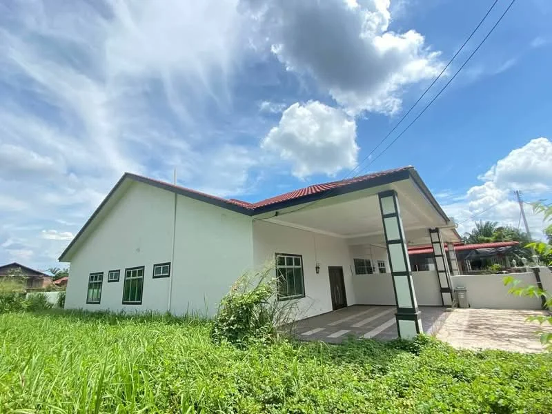 Exterior type: detached bungalow; features: white painted facade, red pitched tile roof, large windows, covered porch area, manicured lawn, surrounded by greenery, single-storey, concrete walkway; style: modern.