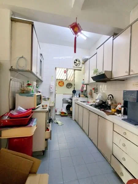 Kitchen features: white cabinetry, ceramic tile flooring, single-bowl stainless-steel sink, chrome pull-down faucet, built-in oven, microwave, stainless-steel kettle, toaster, countertop with appliances, wall-mounted fan, open shelving, decorative hanging ornament, window with natural light.