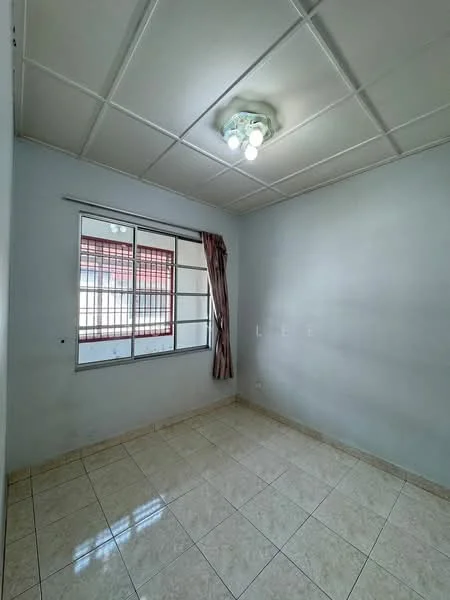 Room features: white painted walls, tile flooring, ceiling with recessed lights, single window with metal grille, curtains, light fixture with multiple bulbs.