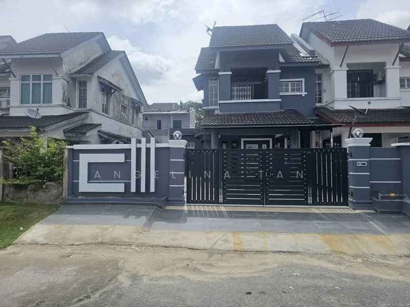 Exterior type: semi-detached house; features: grey painted facade, black metal gate, stone-paved driveway, manicured lawn, two-storey structure, gabled roof, balconies on upper floor, visible air conditioning units, landscaped garden area, modern architectural design; style: modern.