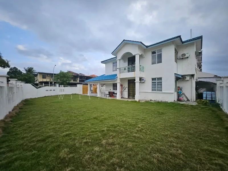 Exterior type: detached bungalow; features: white painted facade, blue pitched tile roof, two-storey structure, manicured lawn, surrounded by low fence, balcony on upper floor, multiple windows, air conditioning units visible, driveway, garden area; style: modern.