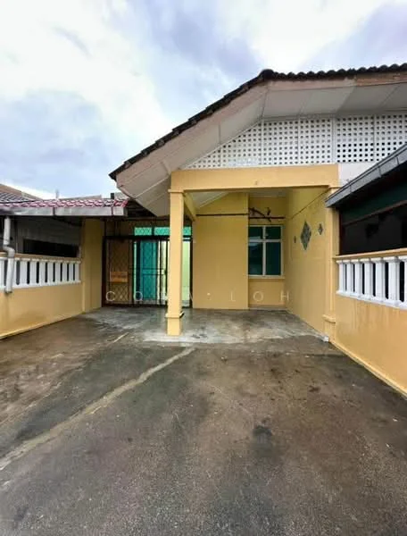 Exterior type: linked terrace house; features: yellow painted facade, pitched roof, front porch with concrete flooring, gated entrance, windows with grilles, side access to backyard, overhang at entrance, exposed eaves; style: traditional.