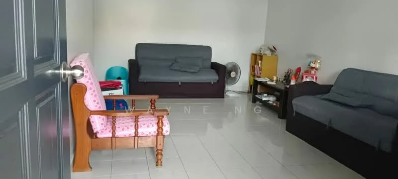 Living features: grey fabric 3-seater sofa, black fabric 2-seater sofa, wooden armchair with pink floral upholstery, white tiled flooring, wall-mounted fan, wooden shelving unit, decorative items on shelves, neutral painted walls; style: modern.