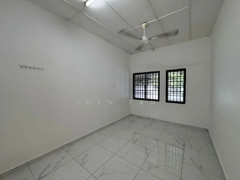Room features: white painted walls, glossy ceramic tile flooring, ceiling fan, two casement windows with black grills, no visible furniture or decor, plain ceiling, wall hooks, natural light from windows; style: minimalist; view: garden.
