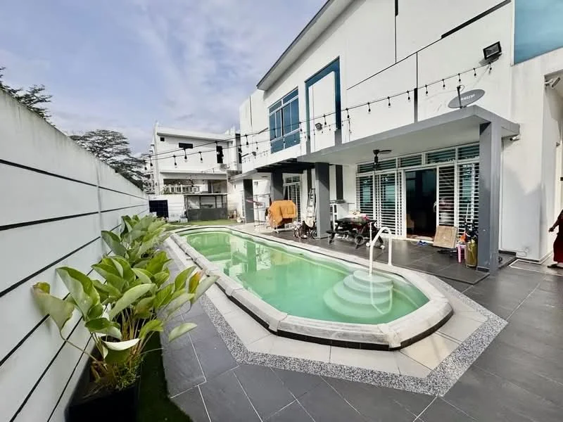 Exterior type: detached bungalow; features: swimming pool with steps, outdoor seating area, landscaped garden with plants, grey tiled flooring, white painted facade, large glass windows, string lights overhead, fenced perimeter, patio area, sliding glass doors; style: modern.