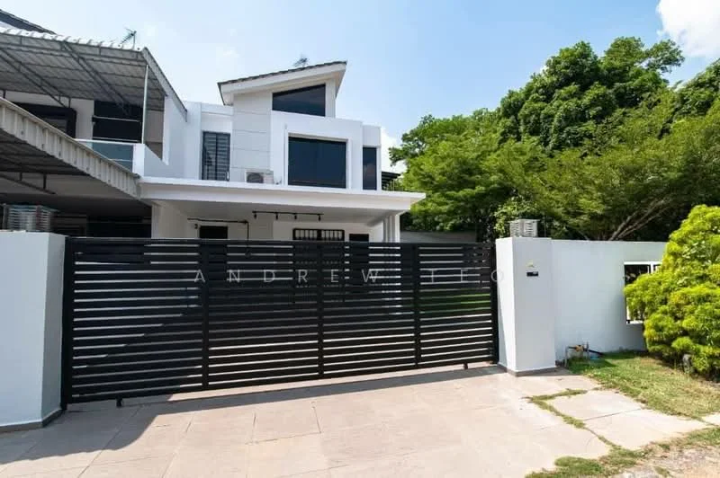 Exterior type: detached bungalow; features: black metal gate, white painted facade, flat roof, two-storey structure, manicured landscaping, paved driveway, large windows, covered carport, surrounded by greenery; style: modern.