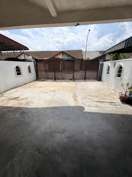 Exterior type: linked terrace house; features: concrete driveway, metal gate, white painted walls, arched windows, roof overhang, surrounding residential buildings, open sky, potted plant; style: traditional.