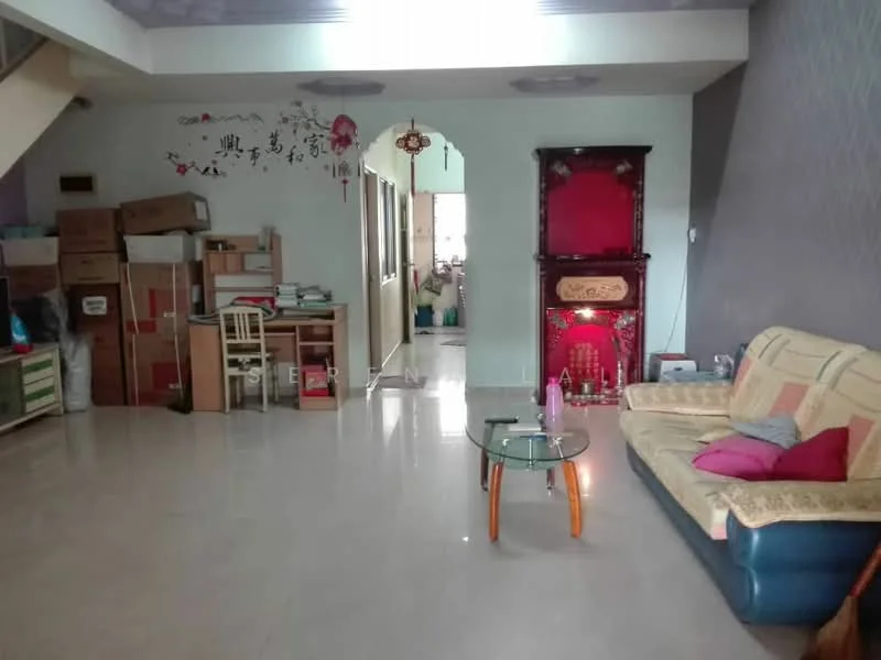 Living features: cream painted walls, grey accent wall, glossy tile flooring, 3-seater fabric sofa in blue, coffee table with glass top, decorative wall art, built-in cabinet, small study desk with chair, red decorative altar, boxes for storage, window with natural light; style: traditional.