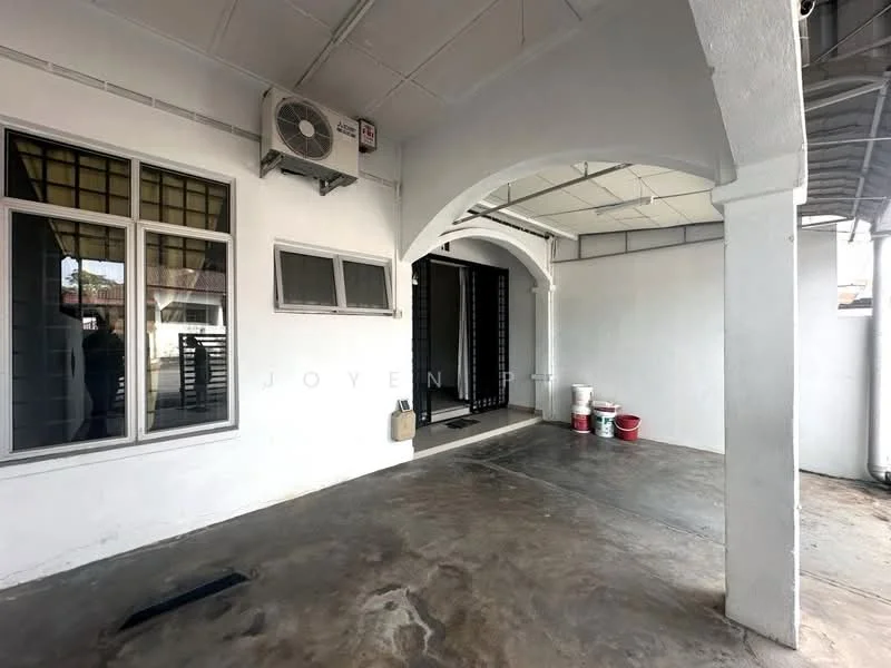 Exterior type: linked terrace house; features: concrete flooring, white painted walls, arched entryway, wall-mounted split AC, security grille door, large windows, outdoor space, painted ceiling, visible drainage, buckets for storage; style: modern.