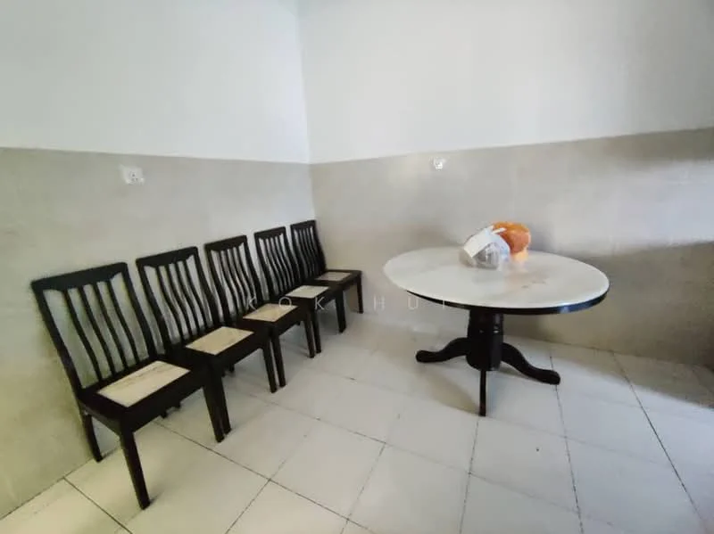 Dining features: round dining table with white top, wooden dining chairs with black finish, six dining chairs, white tiled flooring, light grey painted walls, half-height wall with a different finish, natural light from window, minimalist decor; style: minimalist.