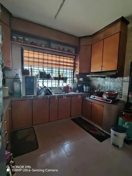Kitchen features: brown wooden cabinetry, black countertop, stainless-steel sink, chrome pull-down faucet, built-in gas stove, exhaust hood, mosaic tile backsplash, window with metal grille, floor tile, kitchen rug, open shelving, microwave, refrigerator.