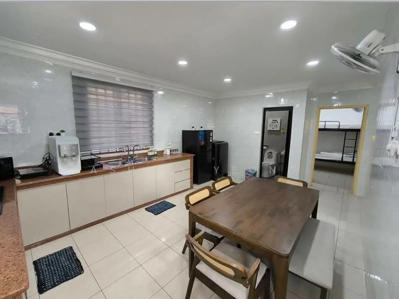 Kitchen features: white glossy tiled walls, cream laminate cabinetry, brown granite countertop, single-bowl stainless-steel sink, chrome pull-down faucet, built-in oven, freestanding refrigerator, microwave, 4-burner gas hob, dining table with 4 chairs, grey upholstered bench seating, recessed LED downlights, window with blinds, tile flooring; style: modern.