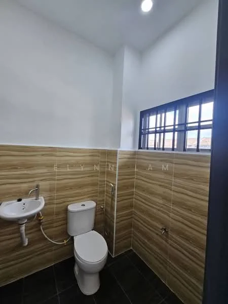 Bathroom features: one-piece toilet, wall-mounted sink, chrome basin mixer, tile cladding on walls, dark ceramic tile flooring, window with metal grille, ceiling light, exposed plumbing; style: modern.