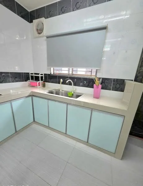 Kitchen features: single-bowl stainless-steel sink, chrome pull-down faucet, white quartz countertop, light blue cabinetry, white tiled backsplash, grey accent wall tiles, wall-mounted air conditioning unit, window with roller blind, kitchen utensils in pink container, pink decorative item on countertop; style: modern.