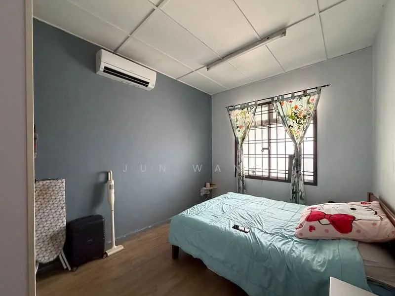 Bedroom features: blue painted walls, wood laminate flooring, 1 wall-mounted split AC, window with floral curtains, queen-size bed with light blue bedding, bedside table, decorative pillows, standing lamp, luggage, wall-mounted mirror.