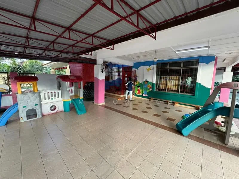 Room features: playground equipment, colorful playhouse, slide, tiled flooring, painted walls with cartoon characters, overhead lighting, open layout, safety railing, decorative wall murals; style: modern.