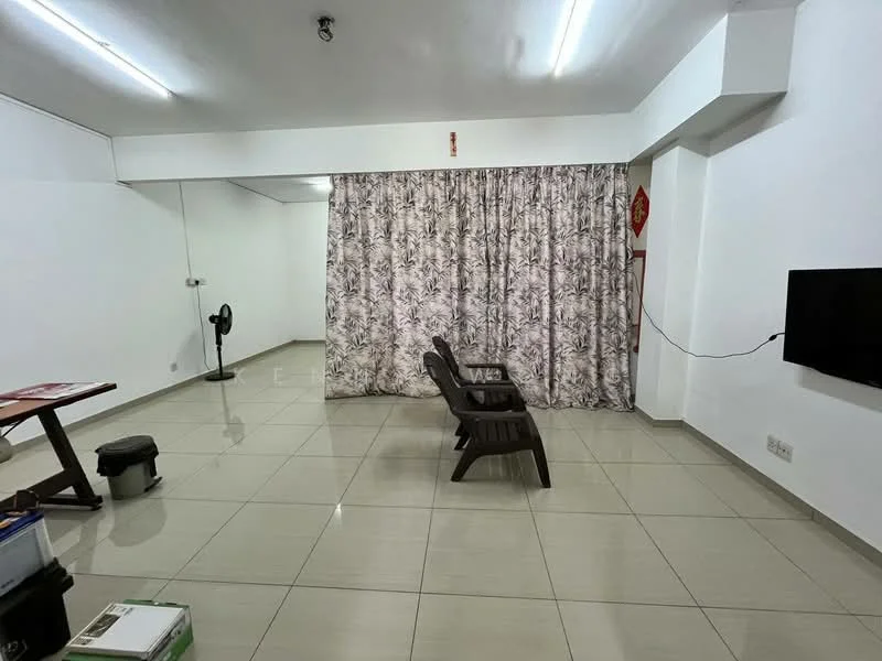 Living features: white painted walls, glossy ceramic tile flooring, recessed ceiling lights, curtains with floral pattern, wall-mounted TV, 2 wooden lounge chairs, small round table, standing fan, black trash bin; style: modern.