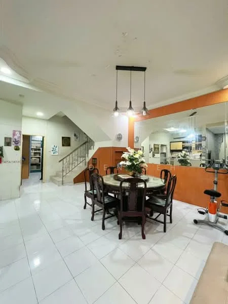 Dining features: round dining table, upholstered dining chairs, white tiled flooring, recessed ceiling lights, decorative wall mirror, staircase in background, orange accent wall, glass display cabinet; style: modern. Room features: white painted walls, open layout, decorative plants.