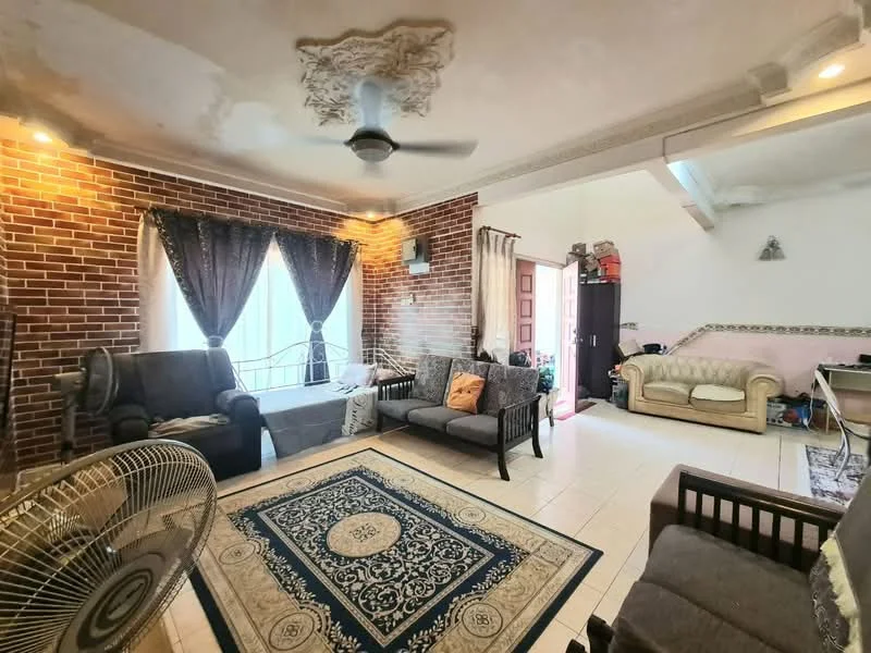 Living features: exposed brick accent wall, white painted walls, tray ceiling with decorative moulding, 5-blade ceiling fan with light, two grey fabric sofas, wooden coffee table, area rug with intricate pattern, floor-to-ceiling windows with sheer curtains, decorative cushions, wall-mounted TV, light-colored tile flooring; style: traditional.