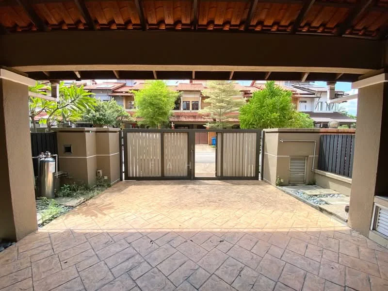 Exterior type: linked terrace house; features: paved driveway, metal gate, landscaped garden with plants, exposed concrete walls, two air conditioning units visible, surrounding greenery, single-storey structure, roof with wooden beams; style: modern.