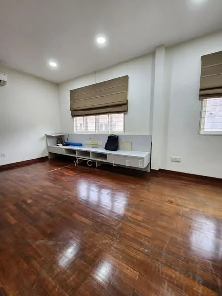 Room features: wooden flooring, white painted walls, two windows with blinds, built-in shelf unit, air conditioning unit on wall; style: modern.
