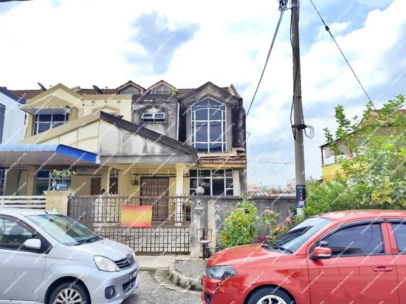 Exterior type: linked terrace house; features: two-storey building, grey painted facade, arched windows, gabled roof, front porch, fenced front yard, driveway with parking space, surrounded by greenery, visible utility pole, two parked cars in front; style: modern.