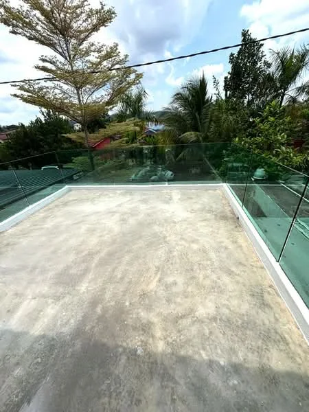 Exterior features: concrete flooring, glass railing, surrounding greenery, trees in view, open sky, outdoor terrace; style: modern.