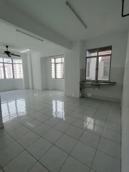 Room features: white painted walls, glossy white floor tiles, ceiling with fluorescent lighting, floor-to-ceiling windows, window with city view, single ceiling fan, stainless-steel sink, wall-mounted counter space; style: modern; view: city.