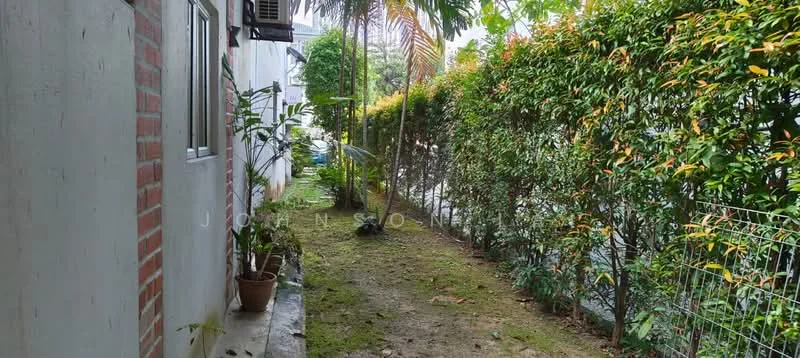Exterior features: narrow pathway, lush greenery, hedge fencing, potted plants, brick wall, concrete surface, tropical landscaping.